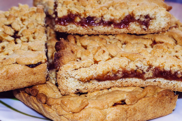 Crumble cakes with apple filling. The cake with jam.