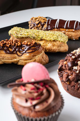 beautiful and delicious cakes, muffins, eclairs, macaron cookies