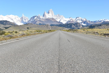 Street to Glacier National Park in El Chalten, Argentina, Patagonia with snow covered Fitz Roy Mountain in background