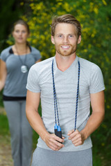 fitness man and woman training in parkwith