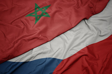 waving colorful flag of czech republic and national flag of morocco.