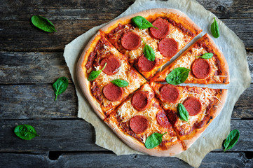Vegan pepperoni pizza with dairy free mozzarella cheese and seitan