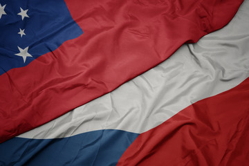 waving colorful flag of czech republic and national flag of Samoa .