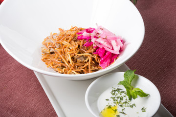 Bowl of noodles with meat