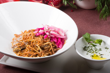 Bowl of noodles with meat