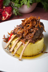 Spicy lamb rack served with garnish