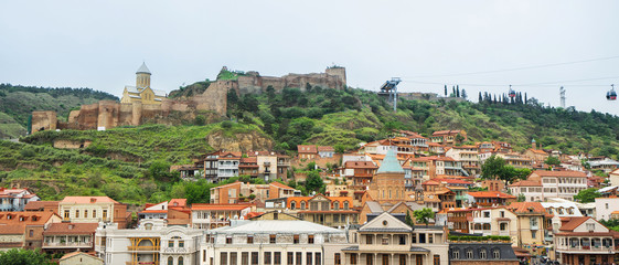Fototapeta na wymiar Panoramic view of Tbilisi, the capital of Georgia with old town and fortress Narikala.