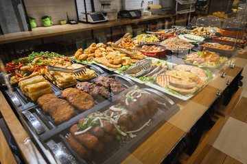 Buffet table served by different dishes, fishes, meat and other ready for eating in restaurant....