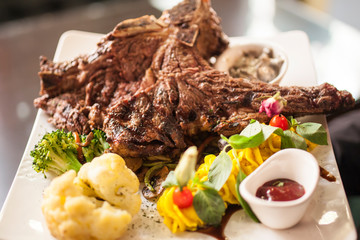 A dish of gigot served with sauce and vegetable