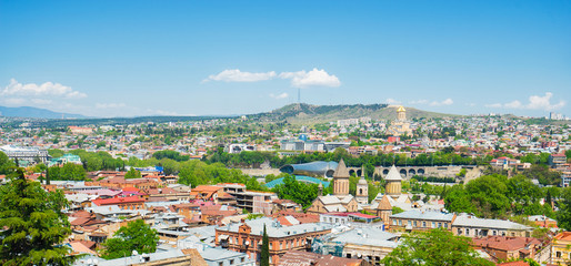 Panoramic view of Tbilisi city from the Narikala Fortress, old town and modern architecture.  Georgia. © upslim