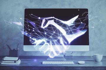 Desktop computer background in office and handshake hologram drawing. Double exposure. Pertnership concept.