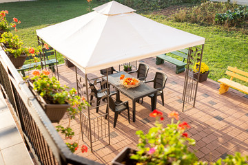 Patio with garden furniture and parasol