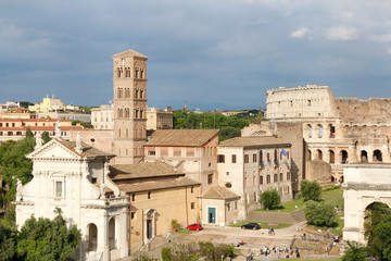 Fototapeta premium Aerial panoramic cityscape view of the Roman Forum during sunset in Rome, Italy