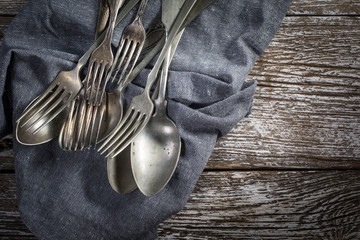 A few old silver spoons and forks.