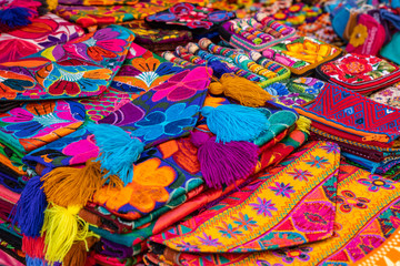 Colorful Mexican crafts for sale at market, Latin America. Mexico travel background.