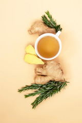 Anti-virus and anti-stress tea with ginger and rosemary on a light background