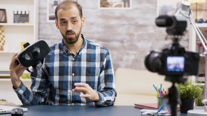 Famous influencer using virtual reality goggles