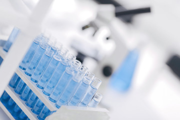 close up. tubes of blue liquid in the science lab