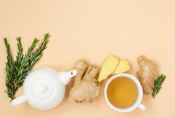 Vitamin and anti-stress tea with ginger and rosemary on a light background