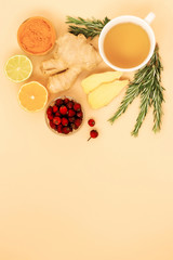 Vitamin and anti-stress tea with ginger, lemon, rosehip, and rosemary on a light background