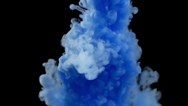 Close-up of blue ink clouds spread in water, small air bubbles and colored smoke spreading underwater on black background