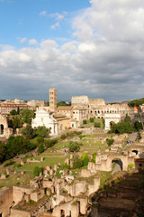 Fototapeta na wymiar Aerial panoramic cityscape view of the Roman Forum and Roman Colosseum during sunset in Rome, Italy