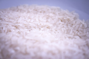 Uncooked white rice. Part of the rice out of focus