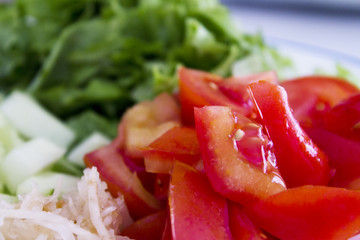Salad with lettuce, tomato, onion and cucumber