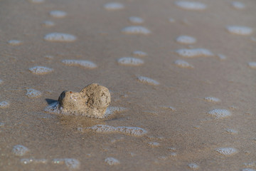 heart-shaped sea stone on the shores of the Mediterranean. there is a place for text