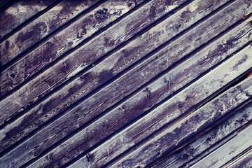 Background from old boards with cracked paint. The texture can be used as a background, in design, as a background for flat lay.