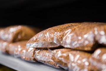 Pockets with buckwheat on the shelf in supermarket