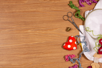 Hand embroidery kit for home made on wooden background