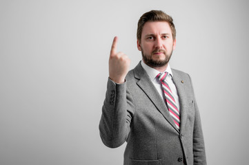 Portrait of business man wearing business clothes showing number one