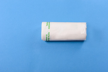 Biodegradable package isolated on the blue backround. Eco friendly.