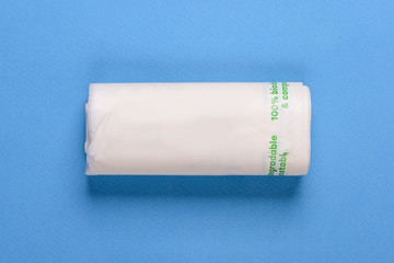 Biodegradable package isolated on the blue backround. Eco friendly.