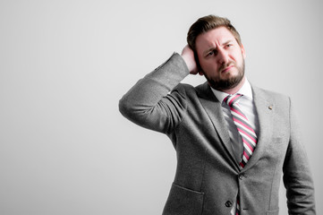 Portrait of business man wearing business clothes gesturing head ache