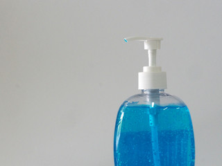 Hand Sanitizer, gel alcoholic mixture with gelatin in clear Plastic bottle with pump pushing, washing clean dirty to prevent germs protect corona virus, covid 19