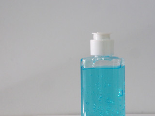 Hand Sanitizer, gel alcoholic mixture with gelatin in clear Plastic bottle with pump pushing, washing clean dirty to prevent germs protect corona virus, covid 19