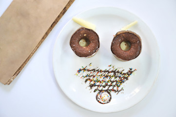 Brownie. Brownie face concept. Coffee desserts. Delicious dessert with coffee.