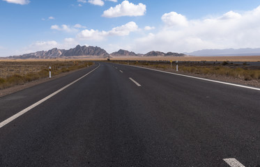 Gobi desert road on vast dry wilderness