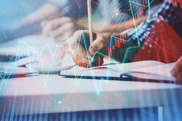 Multi exposure of two men planing investment with stock market forex chart.