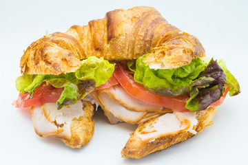 Sandwich of croissant of lettuce, tomato and smoked turkey