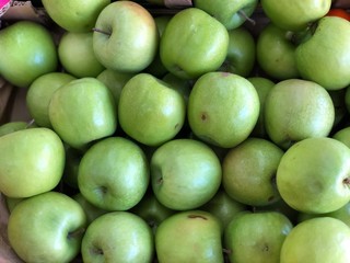fresh green apples in a market