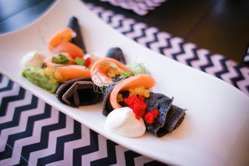 cuttlefish pancakes with red fish