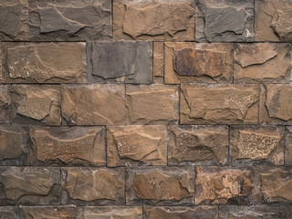 multi-colored large bricks of different shapes close-up - background