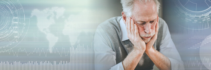 Stressed businessman sitting in office; panoramic banner