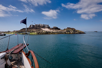 Image of Ile Maitre from the North East. This is the main Island in a reef of rocks known as Les...