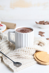 Fototapeta na wymiar Cup of hot chocolate and cookies on table