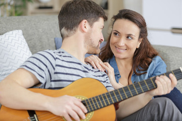 man and woman have fun during their holiday at home