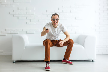 Obraz premium Mature Man On Couch Watching Television
